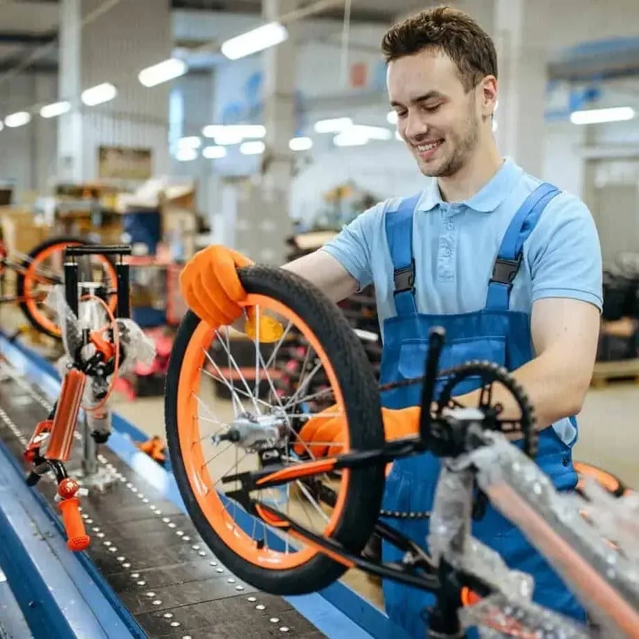 bicycle-factory-assembly-line-wheel-installation-1